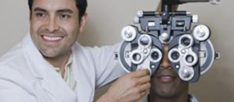 eye doctor smiling during an eye exam