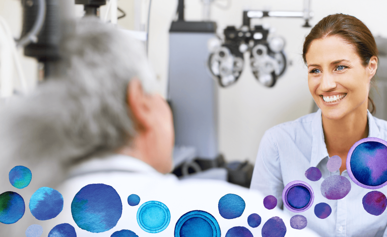 woman smiling with an eye care practitioner