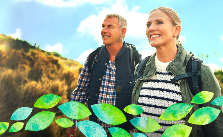 mature man and woman smiling on a hike
